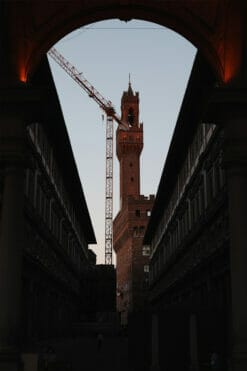 Palazzo Vecchio in Florence, Italy, is framed by the surrounding buildings. By Photographer Scott Allen Wilson.