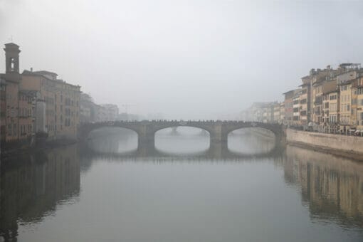 Ponte Santa Trinita in Florence, Italy taken in the midst of a dense fog by Photographer Scott Allen Wilson.
