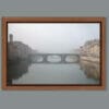 A framed print of Ponte Santa Trinita in Florence, Italy taken in the midst of a dense fog by Photographer Scott Allen Wilson.