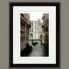 Magical print by Photographer Scott Allen Wilson, of two gondoliers navigating the narrow waterways of Venice Italy.