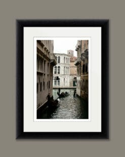 Magical print by Photographer Scott Allen Wilson, of two gondoliers navigating the narrow waterways of Venice Italy.