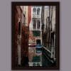 Relaxing photo of a corner in Venice, Italy, taken by Photographer Scott Allen Wilson, with a perfect mirror in the water.