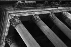 Black and white photography taken by Photographer Scott Allen Wilson in Rome, Italy, shows a tilted view of the Pantheon columns.