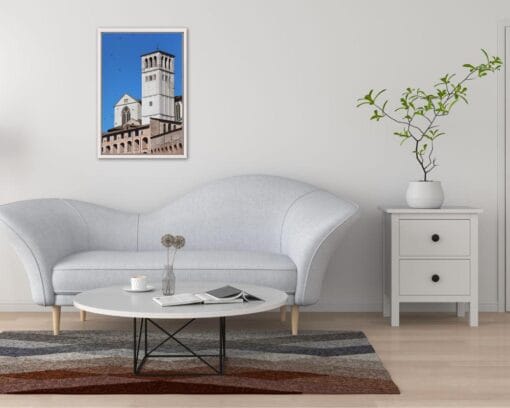 Minimalist living room decoration with a white framed print of the Basilica of St. Francis, located in Assisi, Italy was taken by Photographer Scott Allen Wilson.
