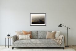 Gray and minimalist living room decoration with a framed print of an Assisi landscape taken in Italy by Photographer Scott Allen Wilson.