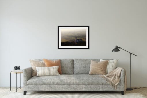 Gray and minimalist living room decoration with a framed print of an Assisi landscape taken in Italy by Photographer Scott Allen Wilson.
