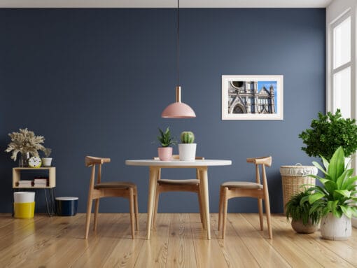 Minimalist dining room decoration with blue wall and a print of a church in Florence by Photographer Scott Allen Wilson