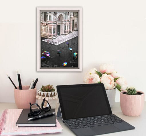 Pink desk decoration with a white framed print of Piazza Del Duomo taken by Photographer Scott Allen Wilson in Florence, Italy.