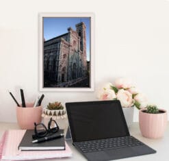 Pink desk decoration with a white framed print of the Florence Cathedral taken by Photographer Scott Allen Wilson in Florence, Italy.