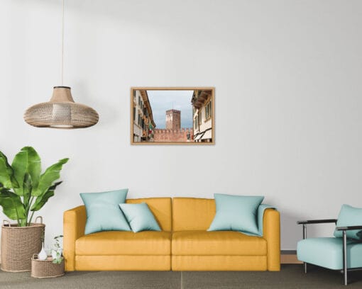 Yellow sofa with till cushions and a framed print of Castelvecchio Museum in Verona, Italy taken by Photographer Scott Allen Wilson