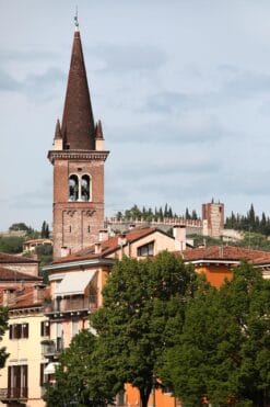 Magical photo of San Tomaso Campanile adorned by trees and colorful buildings in Verona, Italy taken by Photographer Scott Allen Wilson