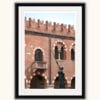 Framed print of a statue of a woman holding a sword in front of the walls of Palazzo della Ragione in Verona, Italy captured by Photographer Scott Allen Wilson
