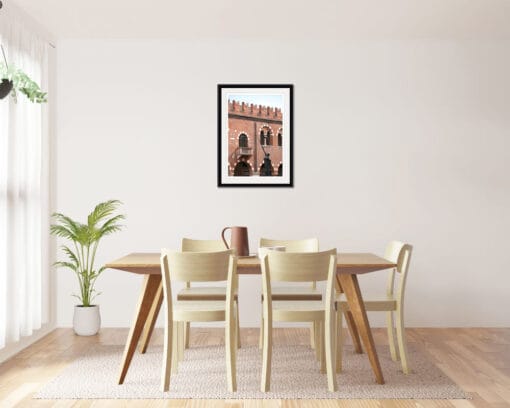 Wooden minimalist dining room that combine with a framed print of the brick walls of Palazzo della Ragione taken in Verona, Italy by Photographer Scott Allen Wilson