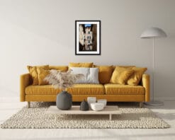 Yellow living room decoration with a framed print on top of the couch portraying Siena, Italy by Photographer Scott Allen Wilson