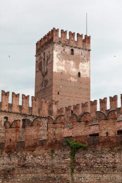 Architecture photography of Castelvecchio tower covered by a tall brick fortress taken by Photographer Scott Allen Wilson in Verona, Italy