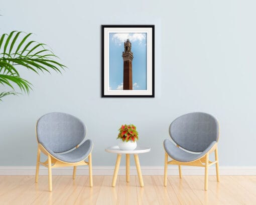 Light blue decoration with two chairs and a framed print of the tower of Palazzo Pubblico in Siena, Italy taken by Photographer Scott Allen Wilson