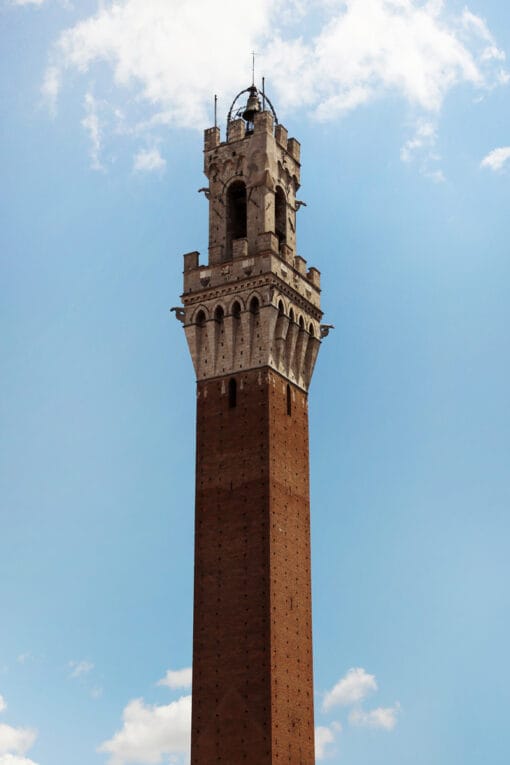 Amazing picture of the tower of Palazzo Pubblico with a sky background taken in Siena, Italy by Photographer Scott Allen Wilson