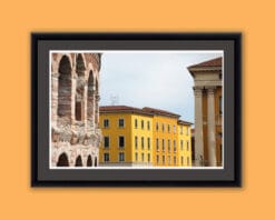 Colorful framed print of the Amphitheater of Verona, Italy next to a bright yellow building taken by Photographer Scott Allen Wilson.