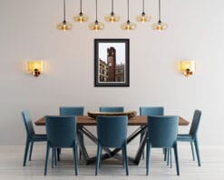 Modern dining room with blue chairs and a framed print of Torre del Gardello in Verona, Italy taken by Photographer Scott Allen Wilson.