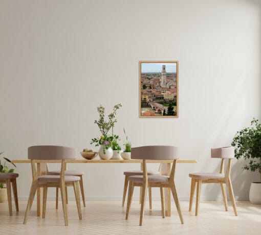 Minimalist wooden dining table design with a framed print on the background portraying a beautiful landscape of Verona, Italy taken by Photographer Scott Allen Wilson