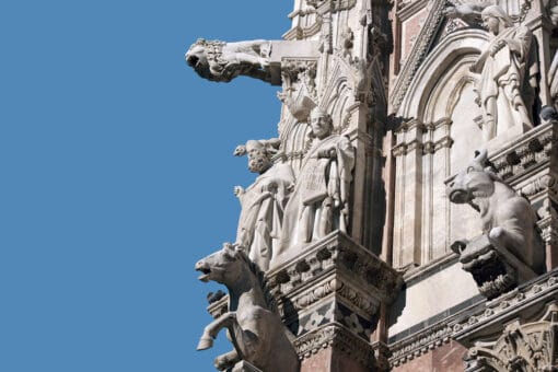 Animal gargoyles adorning the left side of the Duomo Di Siena in Italy taken by Photographer Scott Allen Wilson
