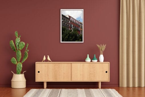 Terracotta wall decoration with wooden furniture and a framed print of Piazza Bellini located in Naples, Italy captured by Photographer Scott Allen Wilson