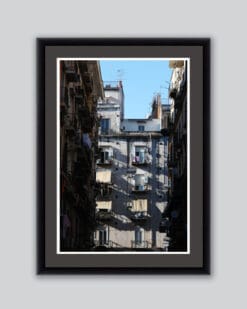 Framed print captured by Photographer Scott Allen Wilson of a residential building framed by a narrow street in Naples, Italy.