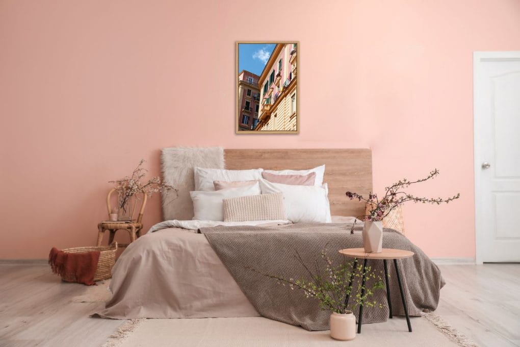 Pink bedroom decoration with a colorful framed print of Via Santa Caterina in Naples, Italy taken by Photographer Scott Allen Wilson