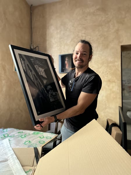 Photo of photographer Scott Allen Wilson at his exhibition at Birreria Art. 17 in Florence, Italy