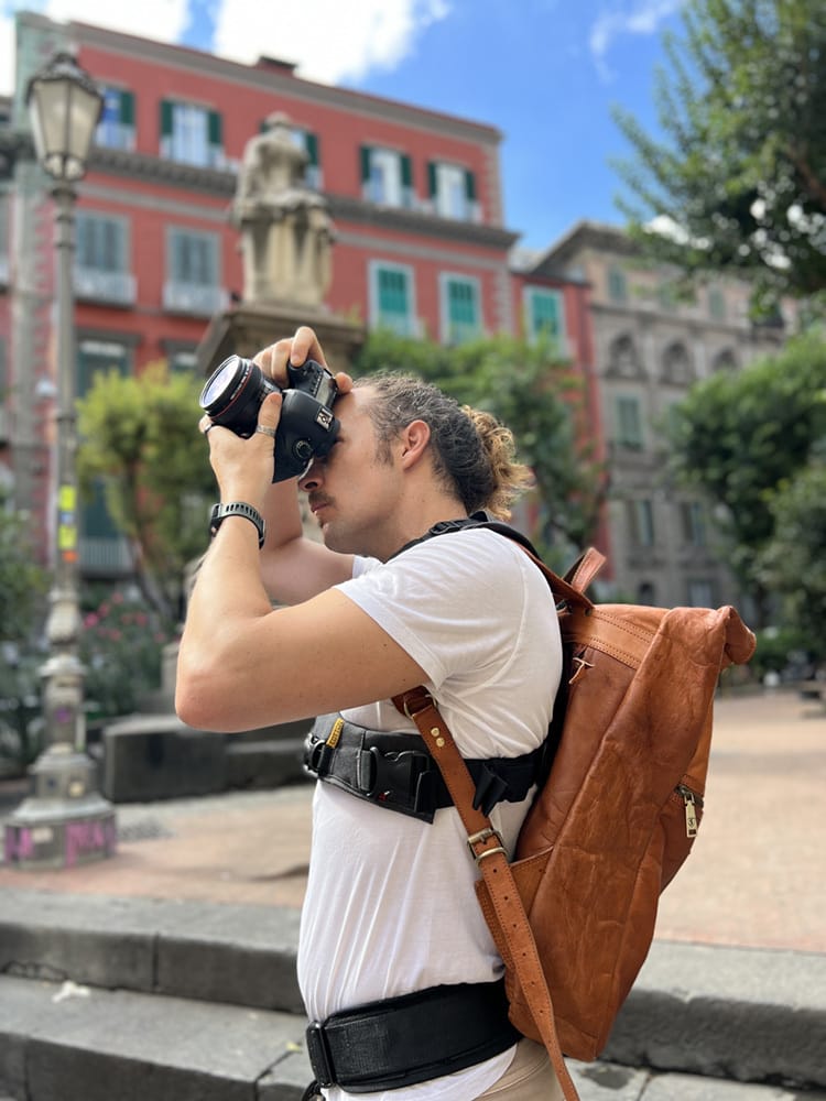 Photographer Scott Allen Wilson taking a photograph in Piazza Bellini in Naples, Italy