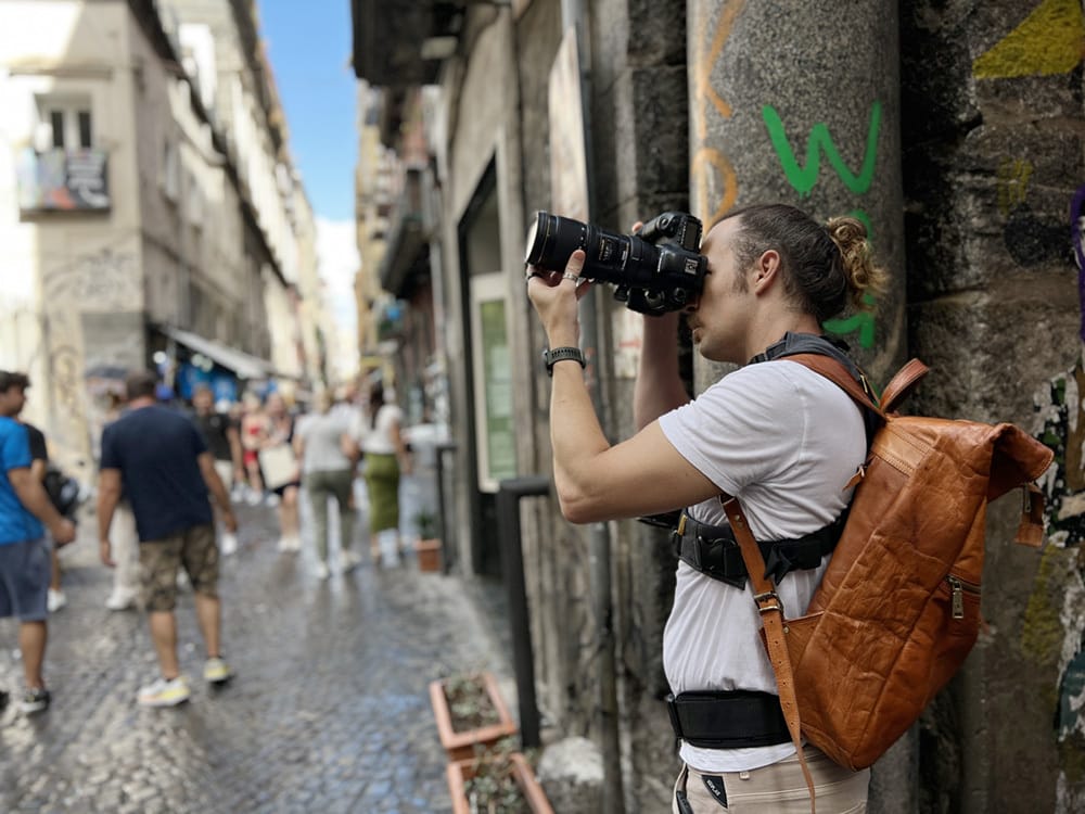 Photographer Scott Allen Wilson capturing an image in the historical center of Naples, Italy