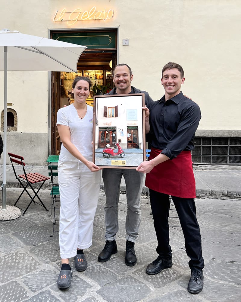 Scott Allen Wilson gifting a framed print to Vivoli Gelateria in Florence, Italy