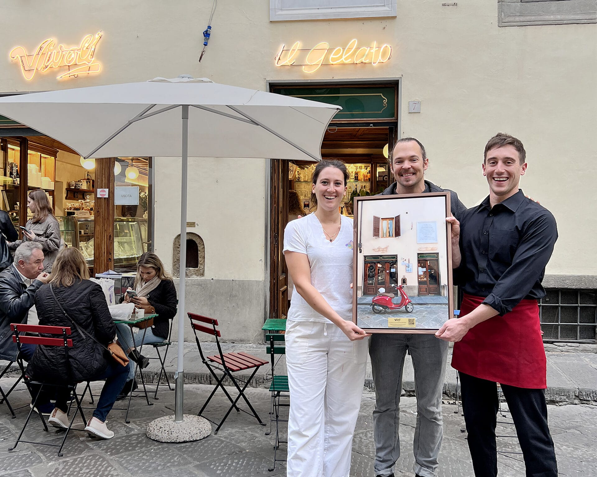 Photographer Scott Allen WIlson presents a gift to Vivoli Gelateria in Florence, Italy