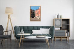 Modern green and gray living room decoration with a colorful framed print of Venice, Italy, taken by Photographer Scott Allen Wilson.