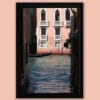 Framed print of Venice, Italy with a pink building in the background and a gondoliere coming out from the left by Photographer Scott Allen Wilson.