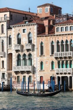 A lonely gondoliere passing by the palaces that stand along the Grand Canal in Venice, Italy taken by Photographer Scott Allen Wilson