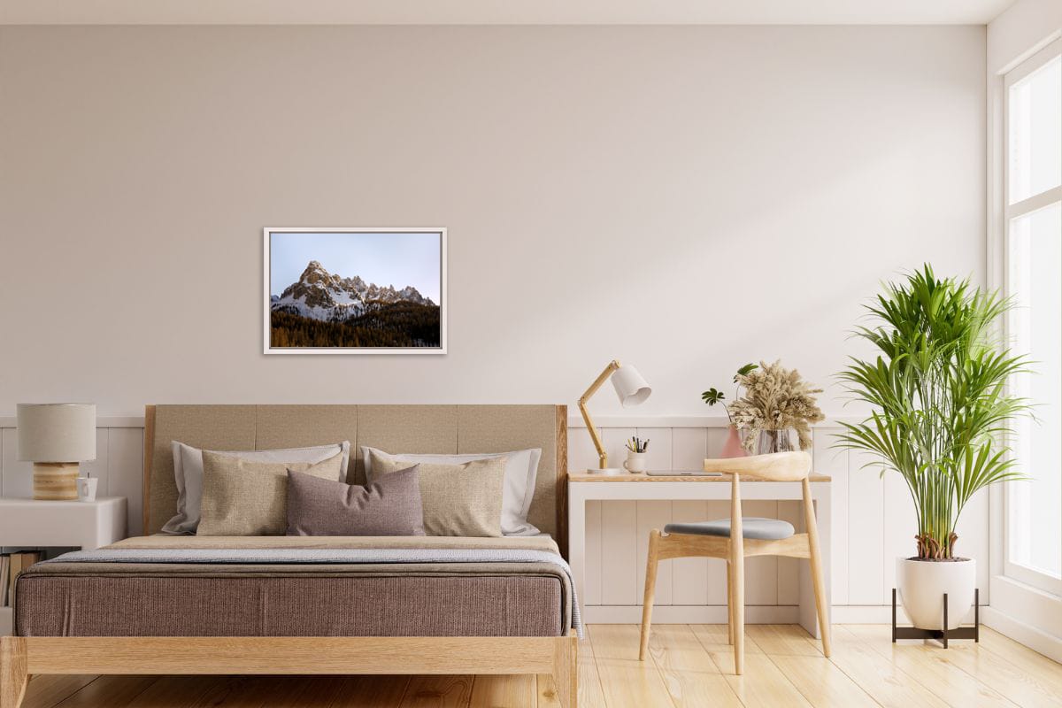 Minimalist bedroom decoration in beige tones with a framed print of the Dolomites, Italy in fall taken by Photographer Scott Allen Wilson