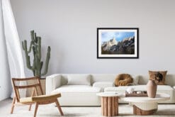Minimalist living room with wooden decoration and a framed print of The Dolomites, Italy by Photographer Scott Allen Wilson.
