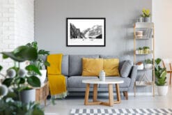 Gray and yellow living room decoration with a black and white framed print of Lago di Braies taken in the Dolomites, Italy by Photographer Scott Allen Wilson.