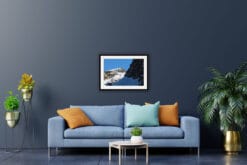 Blue living room decoration with a nature framed print of two jagged peaks of the Dolomites, Italy with an intense blue sky in the background taken by Photographer Scott Allen Wilson.