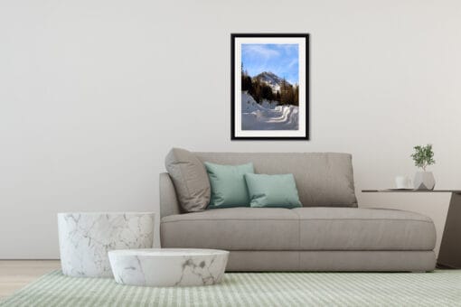 Minimalist and modern gray living room decoration with a portrait framed photo of a snow path leading to a snow-capped mountain of the Dolomites, Italy taken by Photographer Scott Allen Wilson.
