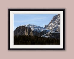 Beautiful landscape framed photo of the Dolomites, Italy and a pine tree forest below, taken by Photographer Scott Allen Wilson.