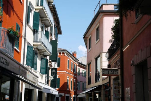 Beautiful photo of the colorful buildings in Peschiera del Garda, Italy taken by Photographer Scott Allen Wilson.