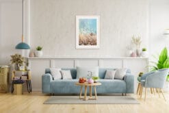 Light blue living room decoration with a photo in a white frame showing the tall grass and a turquoise sky taken in Peschiera del Garda, Italy by Photographer Scott Allen Wilson.