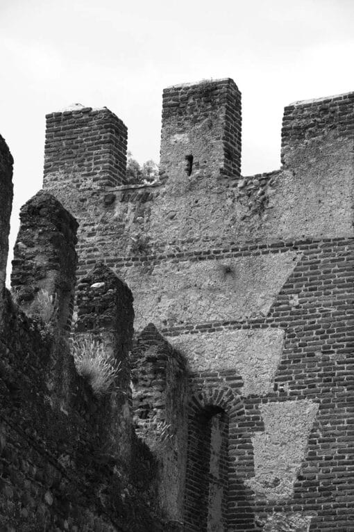 Black and white framed print showing the different angles and geometric shapes of Castello Scagliero di Lazise in Italy taken by Photographer Scott Allen Wilson.