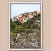 White framed artistic print of Corniglia in Cinque Terre, Italy. Captured by Photographer Scott Allen Wilson.