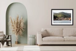 The print of Monterosso al Mare, Italy, hangs in a minimal taupe-hued living room. By Photographer Scott Allen Wilson.