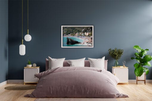 A print of Monterosso al Mare in Cinque Terre, Italy hangs in a modern bedroom with wooden accents. By Photographer Scott Allen Wilson.