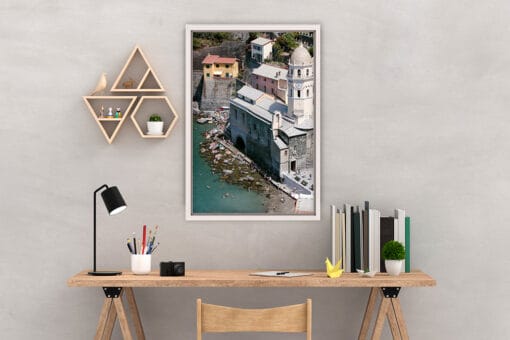 Wooden office furniture is completed by the framed print of Vernazza, Italy, by Scott Allen Wilson
