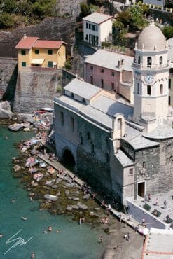 Photo of the coastline and church with bell tower in Vernazza, Cinque Terre, Italy. By Photographer Scott Allen Wilson.